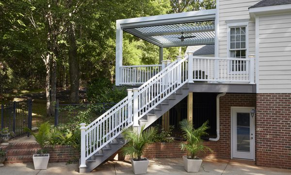 Elevated deck with pergola and custom stairs